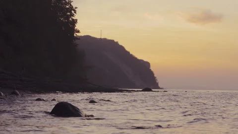 Cliff next to the sea at dusk Stock Footage 253189146