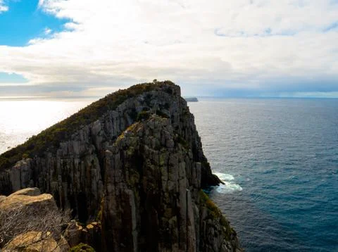 Cliff overlooking ocean Stock Photos