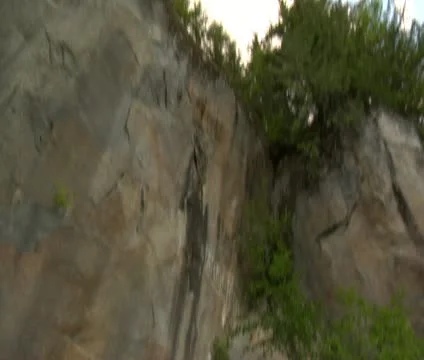Cliff pan down to tunnel opening Video stock 21922955