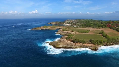 Cliff peninsula covered with grass and paths Stock Footage 111778008