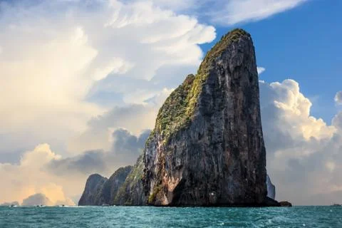 The cliff of Phi Phi leh with big clouds over a blue sky, Phi Phi island, Tha Stock Photos