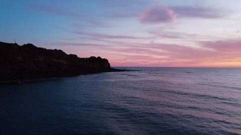 Cliff with pink clouds at sunset 動画素材 260367347
