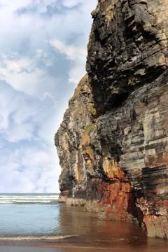 Cliff reflected on ballybunion beach Stock Photos