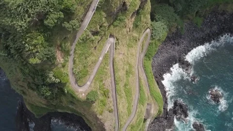 Cliff with road zig zag aerial HD Video stock 235821919