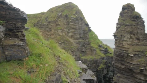 The cliff rock face crane shot over the sea Stock Footage 111555375