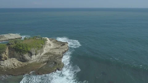 Cliff of rock fall in small island Klayar beach Stock Footage 94395507