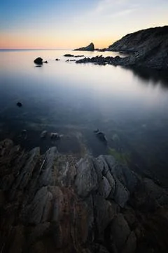 Cliff in Sardinia at the sunset Stock Photos
