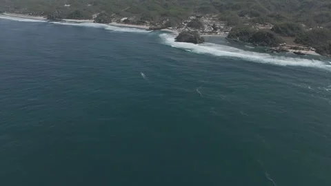 Cliff sea view from drone DJI MINI 4 PRO on yogyakarta beach Stock Footage 285441186