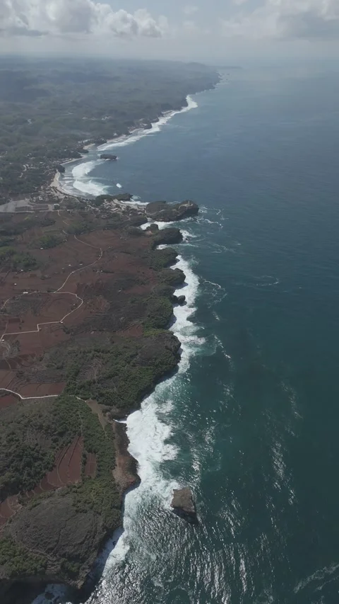 Cliff sea view from drone DJI MINI 4 PRO on yogyakarta beach Stock Footage 285441213