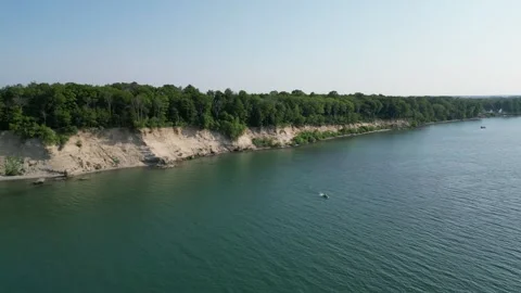 A cliff on the shore of the lake. Stock Footage 246718495