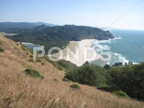 Cliff side beach view Stock Photos