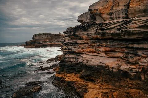 Cliff side of the coast Stock Photos