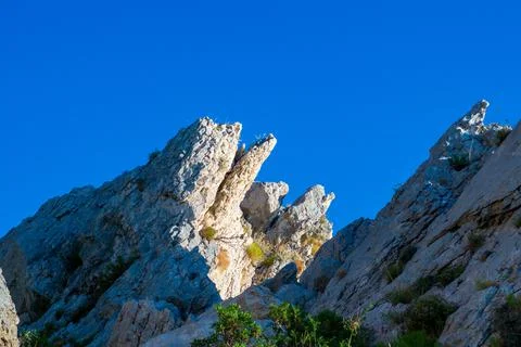 Cliff in sunshine Stock Photos