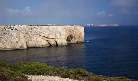 A cliff surrounded by waterscape Stock Photos