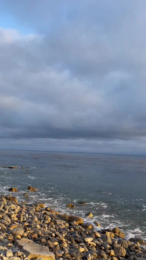 Cliff View Overlooking the Pacific Ocean and Storm Clouds During Sunset Stock Footage 244094203