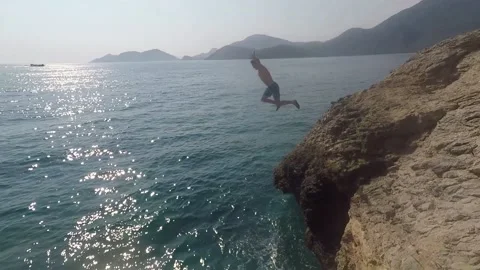 Cliffdiving in oludeniz 1 Stock Footage 132019762