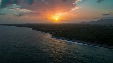Cliffs along Playa Matanzas beach with setting sun in background, Bani in 動画素材 276740826