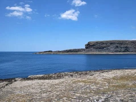 Cliffs and Atlantic ocean background, rocks and laguna, beauty in nature. V.. Stock Photos