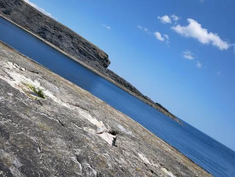 Cliffs and Atlantic ocean background, rocks and laguna, beauty in nature. V.. Stock Photos