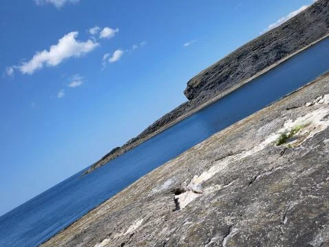 Cliffs and Atlantic ocean background, rocks and laguna, beauty in nature. V.. Stock Photos