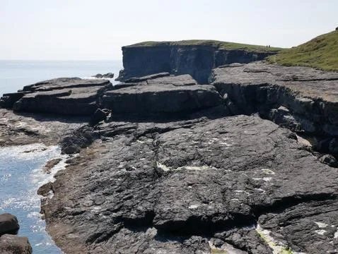 Cliffs and Atlantic ocean background, rocks and laguna, beauty in nature. V.. Stock Photos
