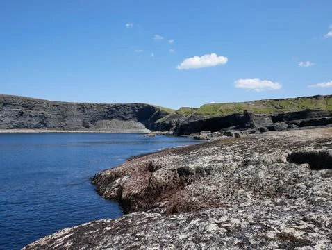 Cliffs and Atlantic ocean, clouds, rocks and laguna, beauty in nature. Vaca.. Stock Photos
