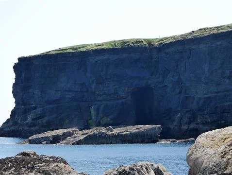 Cliffs and Atlantic ocean, clouds, rocks and laguna, beauty in nature. Vaca.. Stock Photos