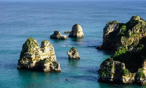 Cliffs and Atlantic ocean in Lagos, Portugal Stock Photos
