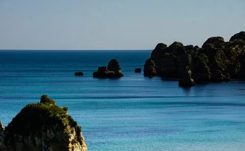 Cliffs and Atlantic ocean in Lagos, Portugal Stock Photos