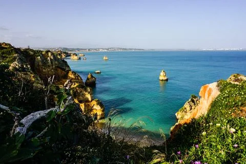Cliffs and Atlantic ocean in Lagos, Portugal Stock Photos