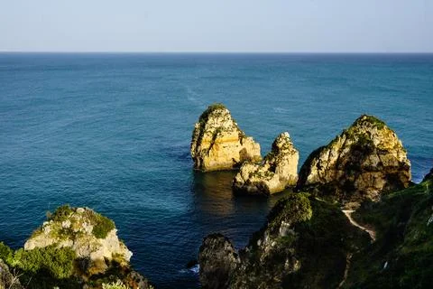 Cliffs and Atlantic ocean in Lagos, Portugal Stock Photos