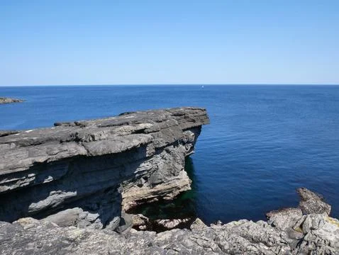 Cliffs and Atlantic ocean, rocks canyon and laguna, beauty in nature. Vacat.. Stock Photos