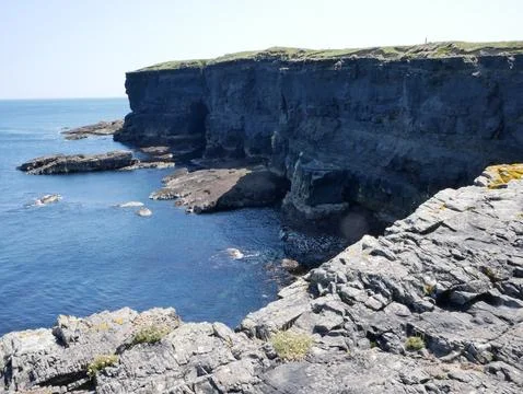 Cliffs and Atlantic ocean, rocks canyon and laguna, beauty in nature. Vacat.. Stock Photos