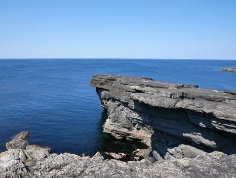 Cliffs and Atlantic ocean, rocks canyon and laguna, beauty in nature. Vacat.. Stock Photos