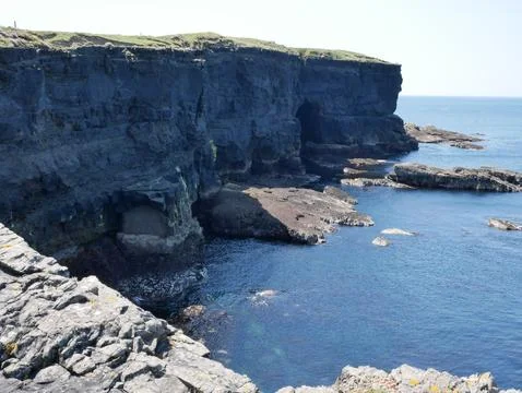 Cliffs and Atlantic ocean, rocks wall and laguna, beauty in nature. Vacatio.. Stock Photos