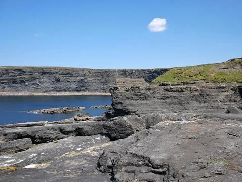 Cliffs and Atlantic ocean, rocks wall and laguna, beauty in nature. Vacatio.. Stock Photos