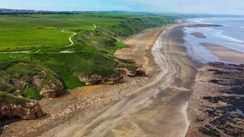 Cliffs and beach at Blackhall Rocks and Cromdon Dene Beach Stock Footage 165306552