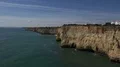 Cliffs and clouds ocean side coastline timelapse with homes in Portugal 4k or 4k+ Resolution