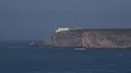 Cliffs and coastline with lighthouse zoom out at Portugal Sagres 4k 4k or 4k+ Resolution