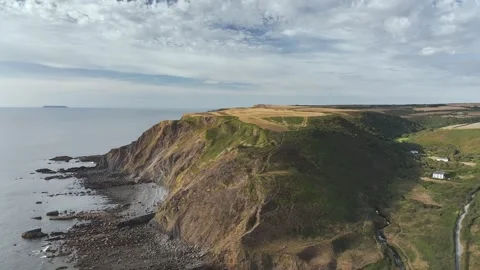 Cliffs and Fields over Welcombe Mouth Beach from a drone, North Devon and Stock Footage 342187698