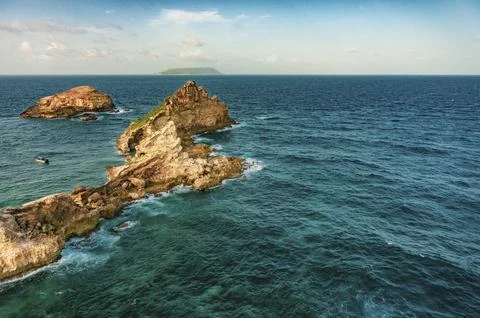 Cliffs and ocean breaking on rocks seen from Pointe des Chateaux Stock Photos