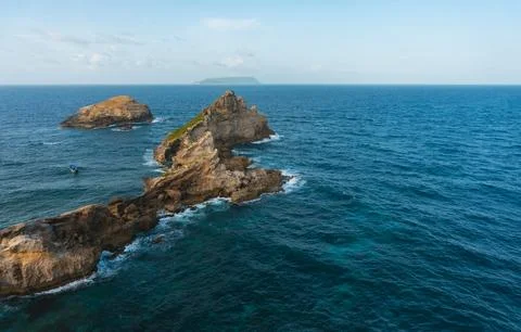 Cliffs and ocean breaking on rocks seen from Pointe des Chateaux Stock Photos