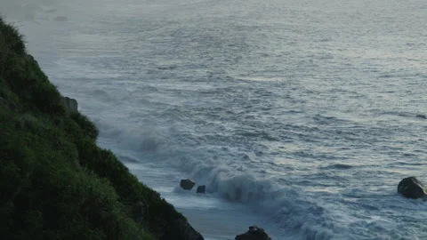 Cliffs and ocean wave in golden sunrise light. Stock Footage 340045779