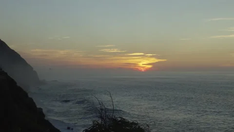 Cliffs and ocean wave in golden sunrise light. Stock Footage 340046034