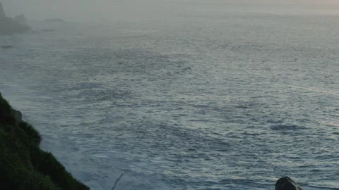 Cliffs and ocean wave in golden sunrise light. Stock Footage 340046067