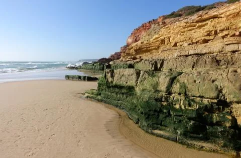 Cliffs and rock formations on the beach of Salema on the Algarve Stock Photos