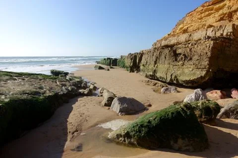 Cliffs and rock formations on the beach of Salema on the Algarve Stock Photos