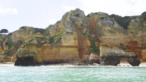 Cliffs and rock formations seen from a boat in Lagos Portugal Algarve Stock Footage 273285798