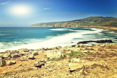 Cliffs and rocks on the Atlantic ocean coast in Sintra in a beautiful summer Stock Photos