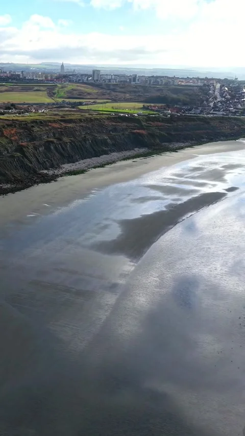 Cliffs and shining beach in backlight near Boulogne-sur-Mer, vertical Stock Footage 347179065